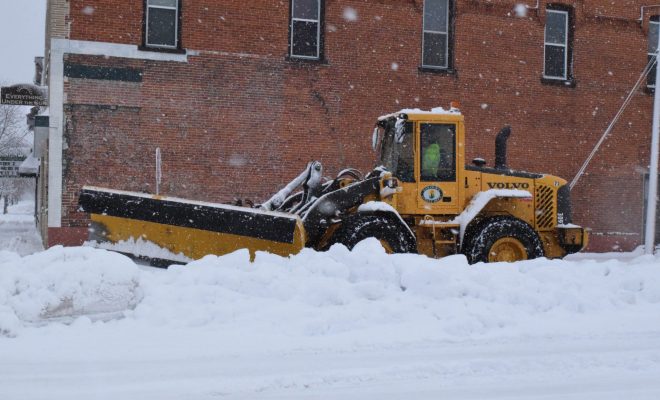 City of Tomahawk Employee Plowing Snow