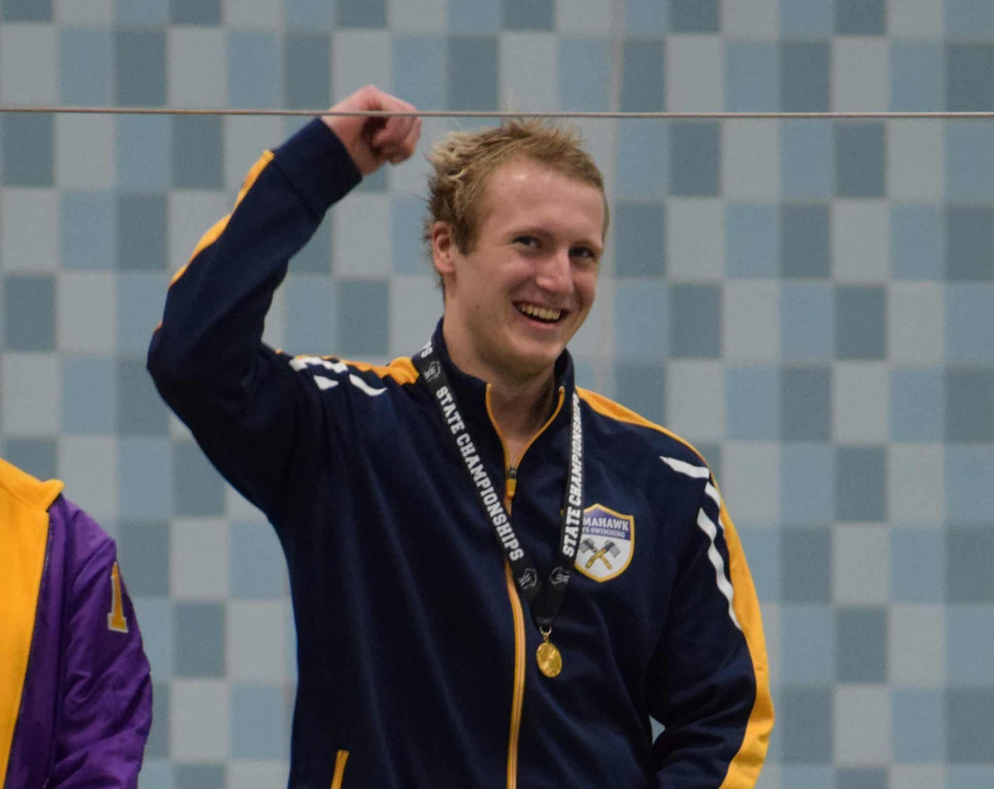 Travis Phillips wins 50 Free to become Tomahawk’s first State Swim Champion: Hatchet boys’ swim team scores 52 points in Madison for 17th place