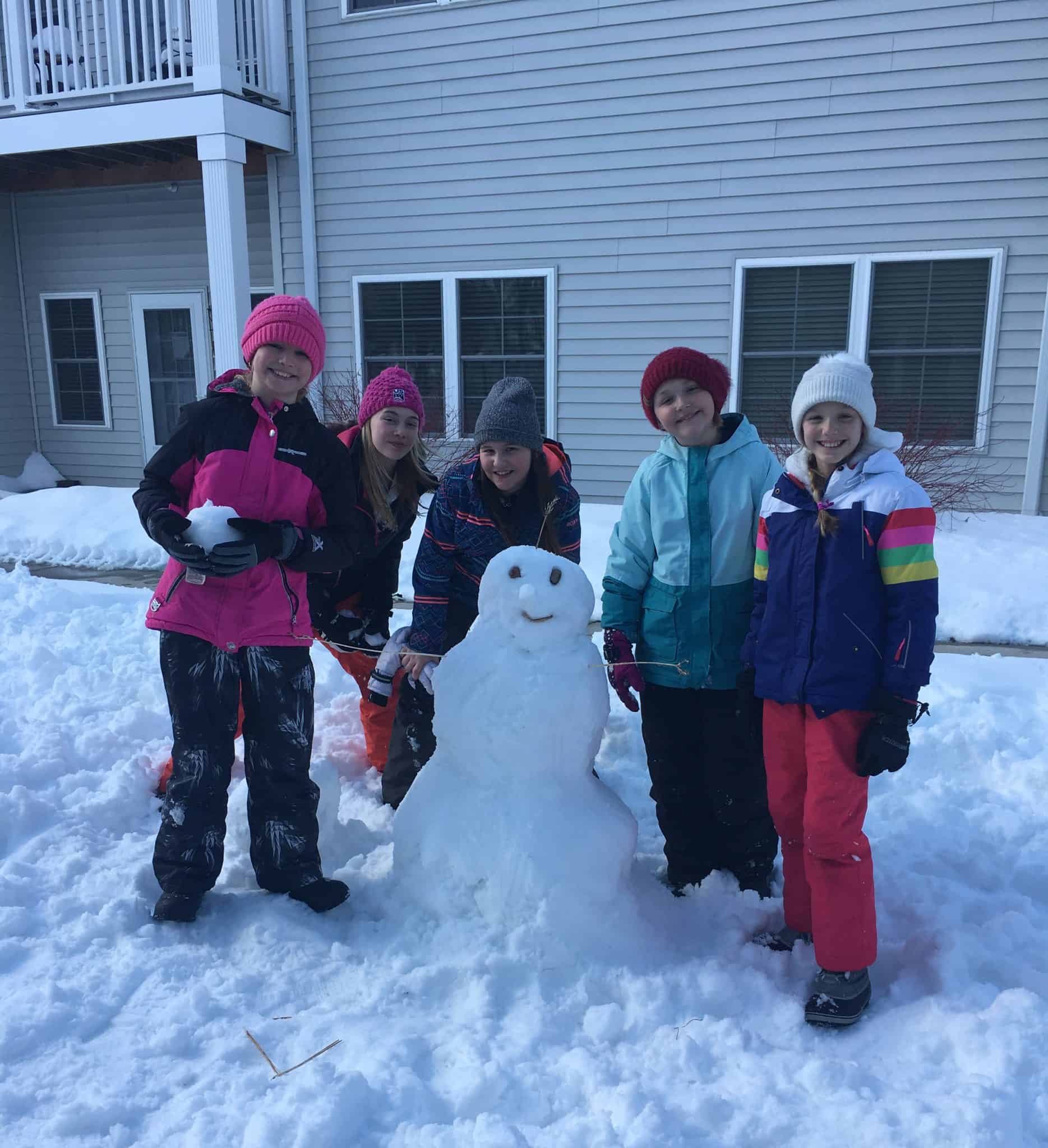 St. Mary students build snowmen at Milestone Senior Living