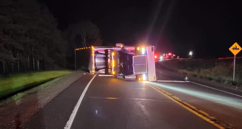Truck hauling 40,000 pounds of butter rolls over on State Rd. 64
