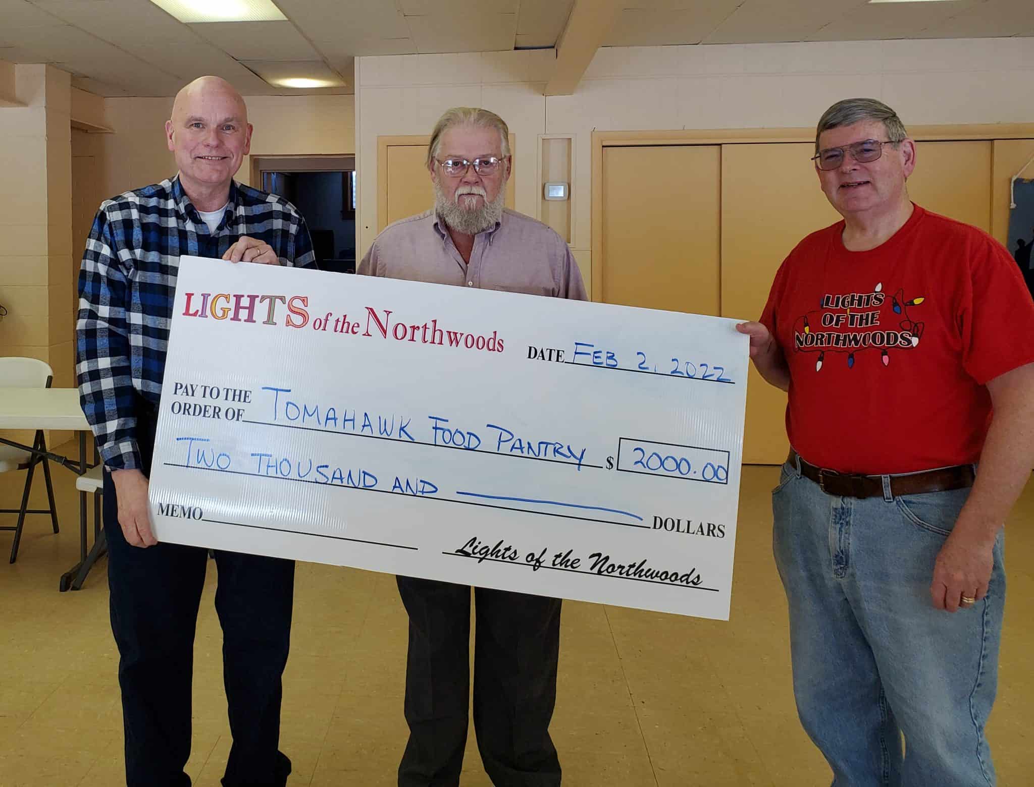 Lights of the Northwoods donates to Tomahawk Food Pantry