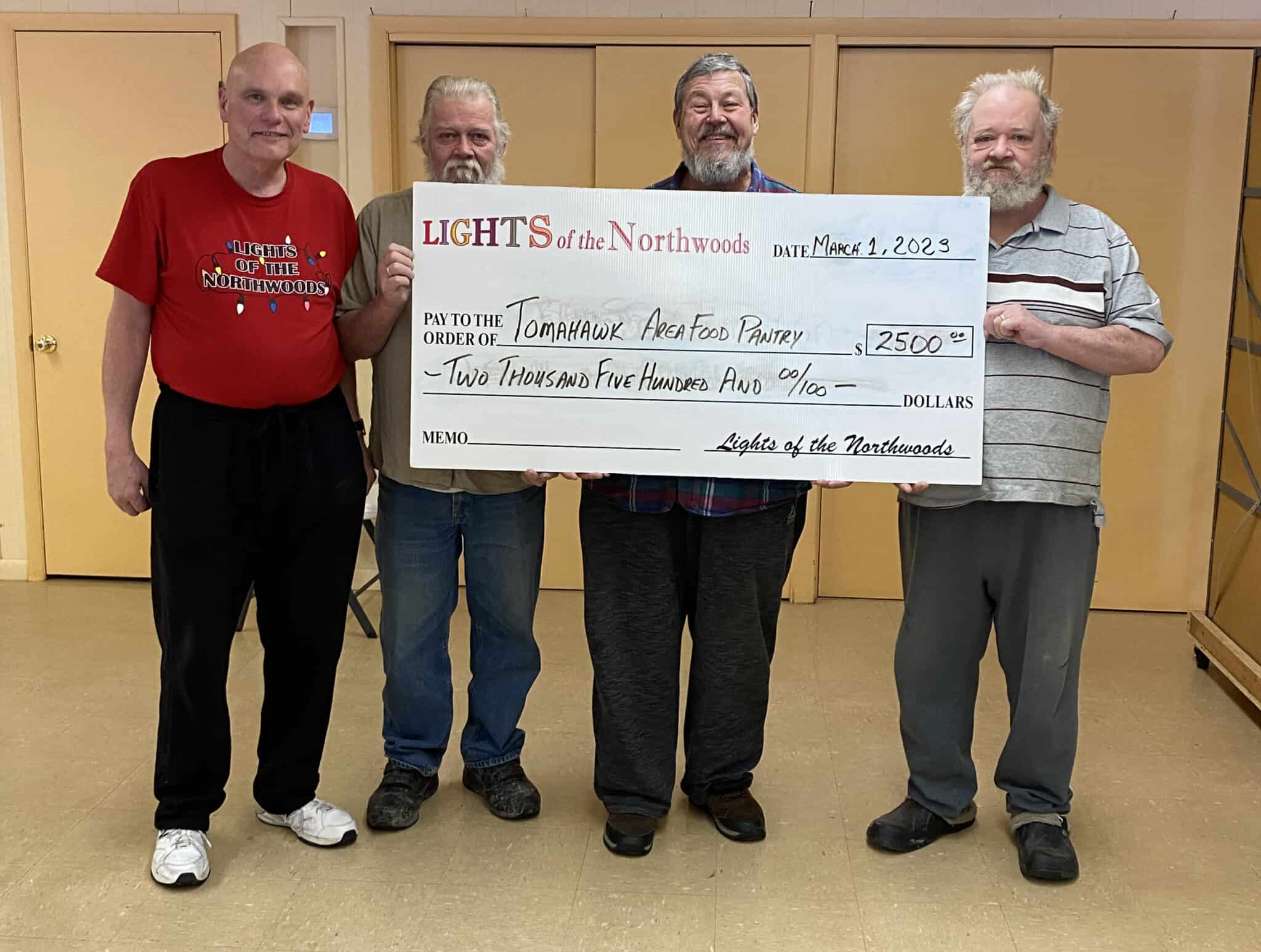 Lights of the Northwoods makes donation to Tomahawk Area Food Pantry